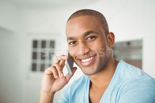 Handsome man having phone call Stock photo © wavebreak_media