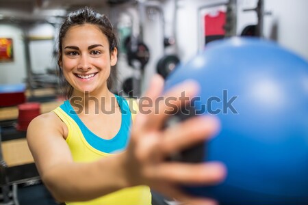 Muscular man posing with athletic women behind Stock photo © wavebreak_media