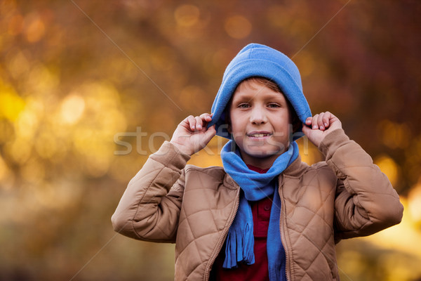 Portrait of smiling boy showing knit hat Stock photo © wavebreak_media
