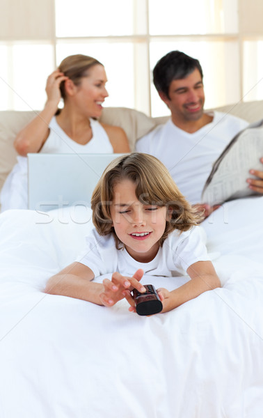 Stock photo: Adorable son watching TV