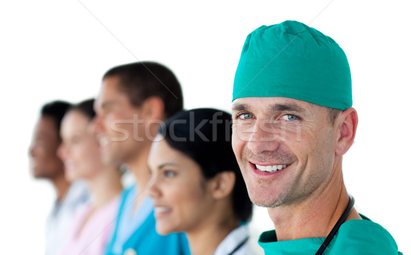 Cirujano sonriendo cámara equipo trabajo médicos Foto stock © wavebreak_media