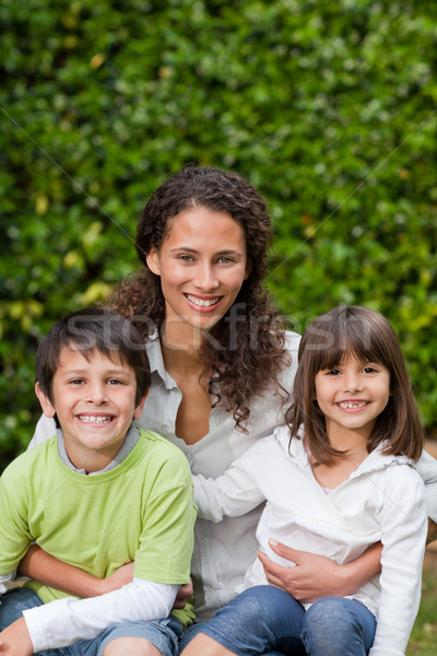 Mother with their children looking at the camera in the garden Stock photo © wavebreak_media