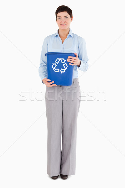 Businesswoman with a recycling bin against a white background Stock photo © wavebreak_media