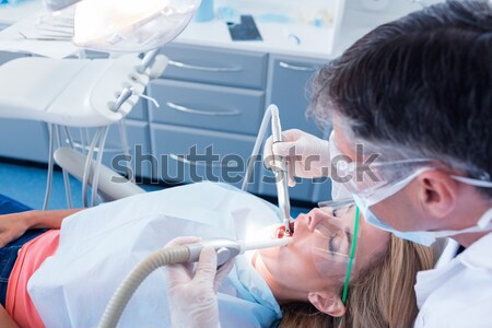 Cute chemistry students looking at a liquid in a laboratory Stock photo © wavebreak_media