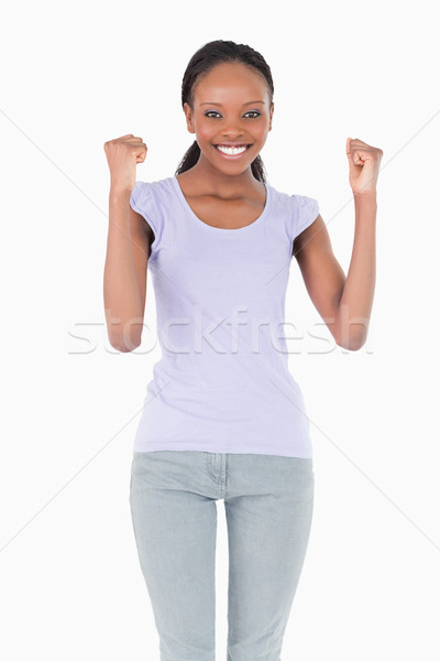 Close up of smiling woman celebrating success on white background Stock photo © wavebreak_media