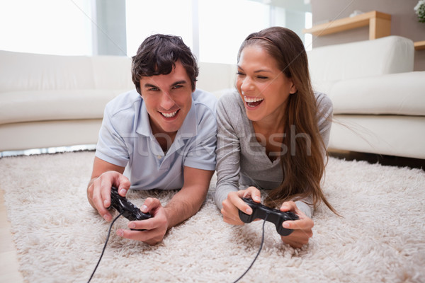 Fiatal pér játszik videojátékok együtt boldog otthon Stock fotó © wavebreak_media