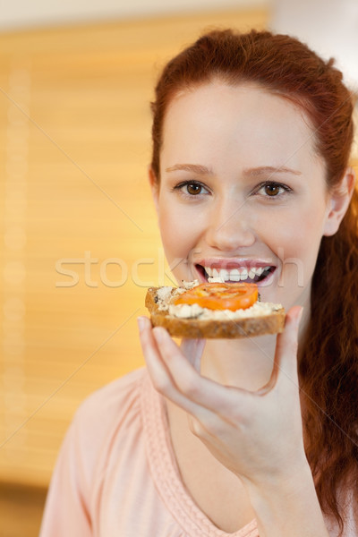 Woman having a slice of bread with tomato Stock photo © wavebreak_media