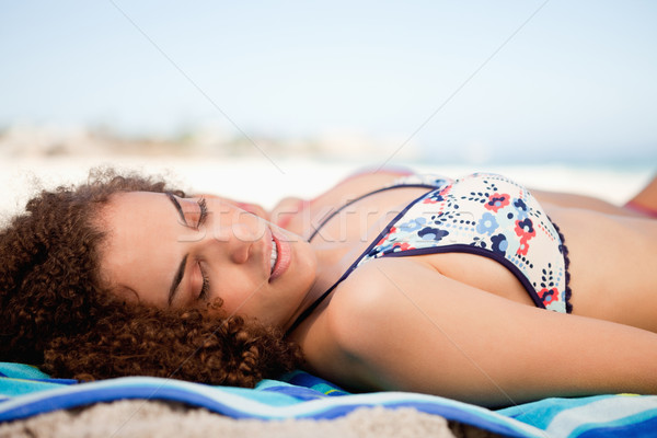 Side view of a young woman napping while turning her head on the side Stock photo © wavebreak_media
