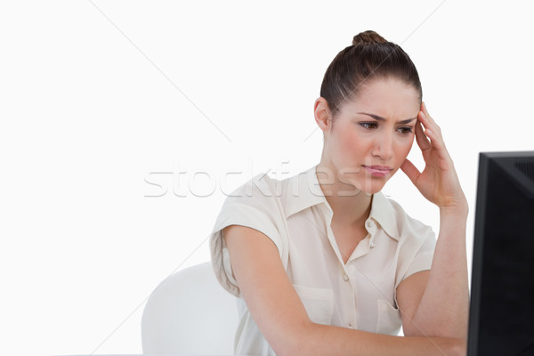 Sad businesswoman using a monitor against a white background Stock photo © wavebreak_media