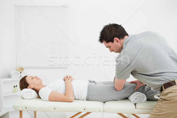 Woman lying on her back while being massaged by a man in a room Stock photo © wavebreak_media