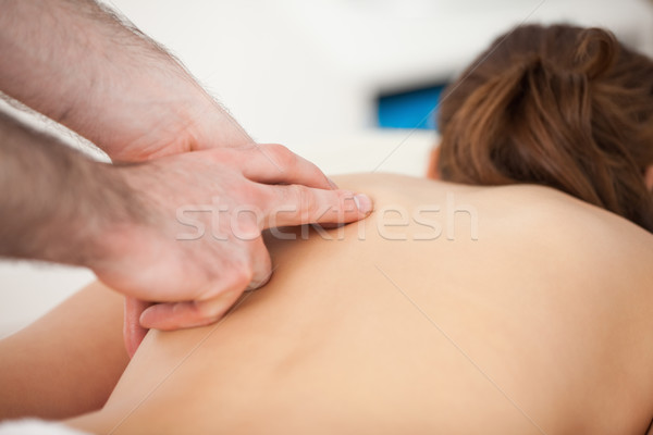 Doctor massaging his patient while using only two fingers in a room Stock photo © wavebreak_media
