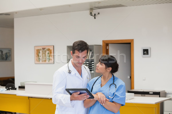 Doctor holding a tablet computer next to a nurse in hospital ward Stock photo © wavebreak_media