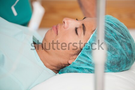 Stock photo: Patient lying on gurney before surgery in hospital corridor