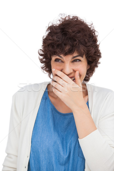 Smiling woman with hand on her mouth Stock photo © wavebreak_media