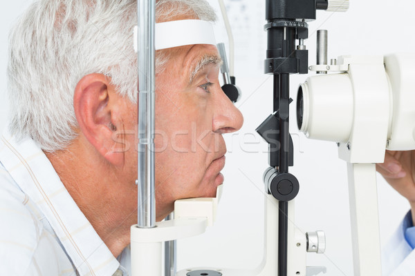 Senior man getting his cornea checked Stock photo © wavebreak_media
