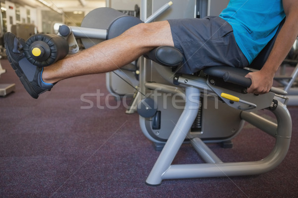 Focused man using weights machine for legs Stock photo © wavebreak_media