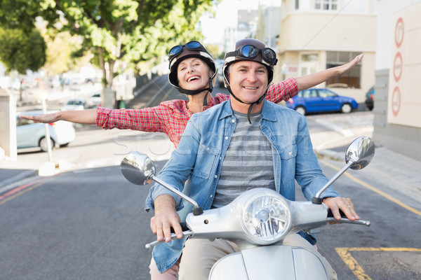 Heureux maturité couple équitation ville [[stock_photo]] © wavebreak_media