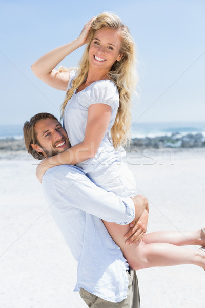 Stock photo: Cute couple hugging on the beach