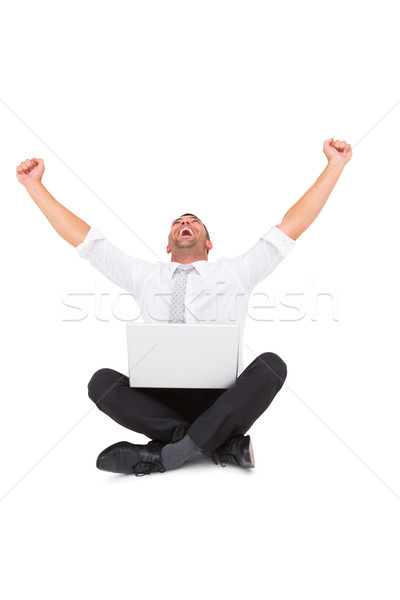 Businessman using laptop and cheering Stock photo © wavebreak_media