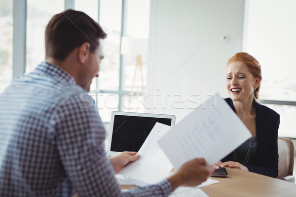 Executive discussing over document at desk Stock photo © wavebreak_media