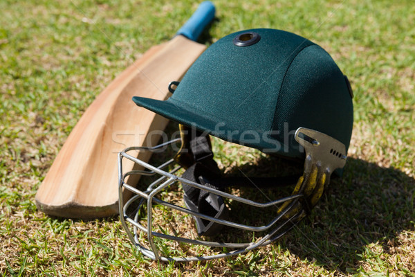 High angle view of cricket helmet and bat on field Stock photo © wavebreak_media