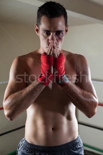 Thoughtful man standing in boxing ring Stock photo © wavebreak_media