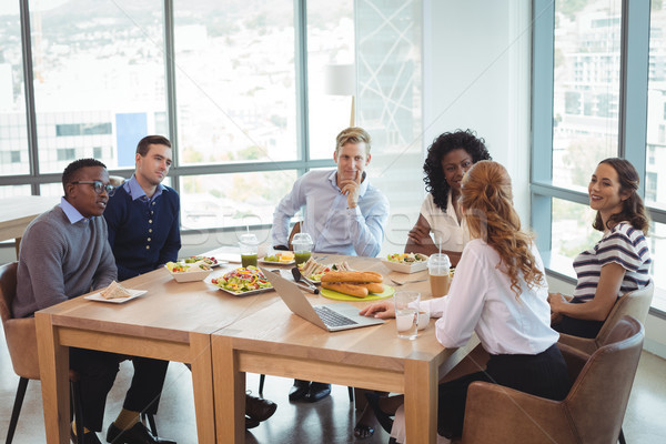 Business people discussing while sitting around breakfast table Stock photo © wavebreak_media