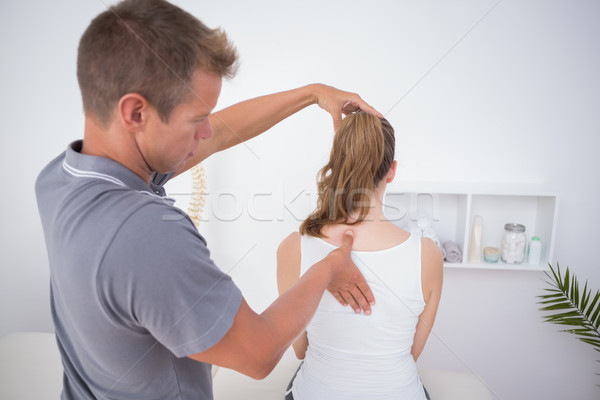 Stock photo: Doctor examining his patient back