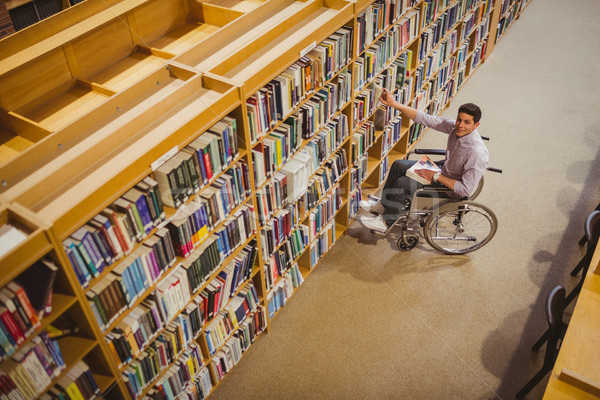 Foto d'archivio: Studente · sedia · a · rotelle · libro · shelf · biblioteca