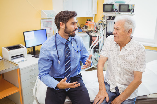 Male doctor examining a patient Stock photo © wavebreak_media