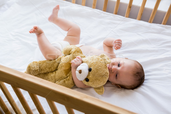 Baby lying on baby bed Stock photo © wavebreak_media