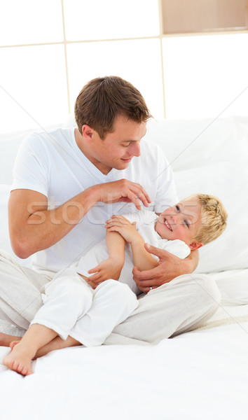 Animated dad and his little boy playing on a bed Stock photo © wavebreak_media
