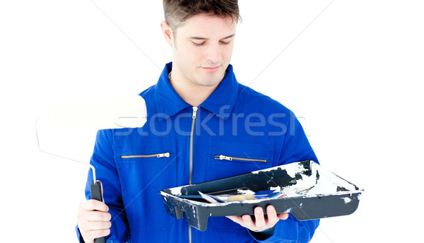 Young male worker holding colors and brush Stock photo © wavebreak_media