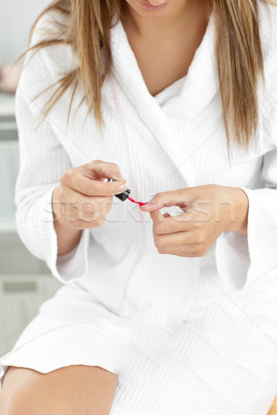 Beautiful caucasian woman varnishing her fingernails in the bathroom at home Stock photo © wavebreak_media