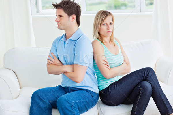 young caucasian couple sulking after a conversation sitting back to back on the sofa at home Stock photo © wavebreak_media