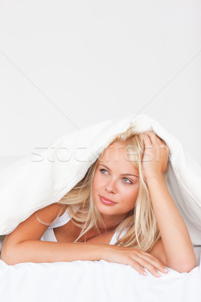 Stock photo: Portrait of a dreaming woman under a duvet