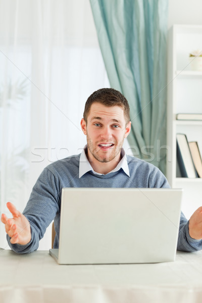 Young businessman having no idea what's wrong with his laptop in his homeoffice Stock photo © wavebreak_media