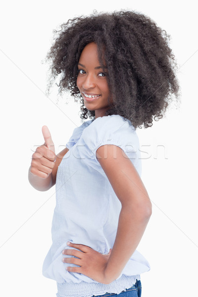Mosolygó nő mutat remek kéz csípő divat Stock fotó © wavebreak_media