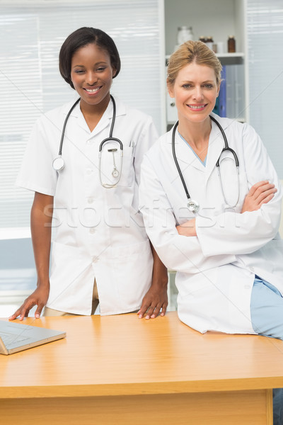 Doctor and nurse smiling at camera Stock photo © wavebreak_media