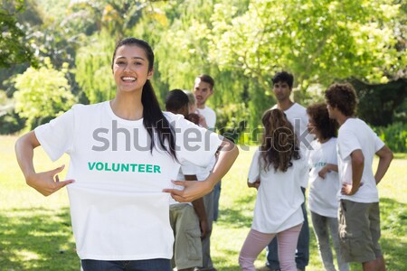 Beautiful volunteer pointing at tshirt Stock photo © wavebreak_media
