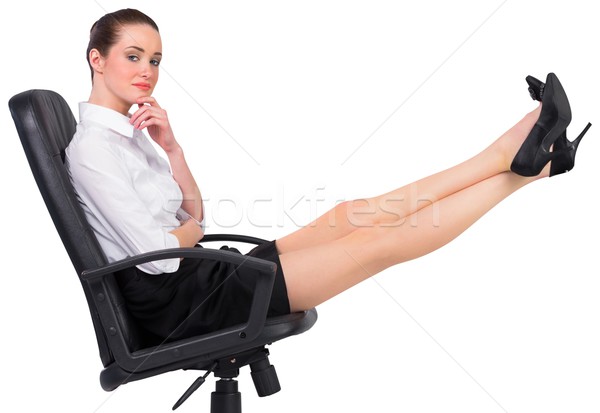 Businesswoman sitting on swivel chair with feet up Stock photo © wavebreak_media