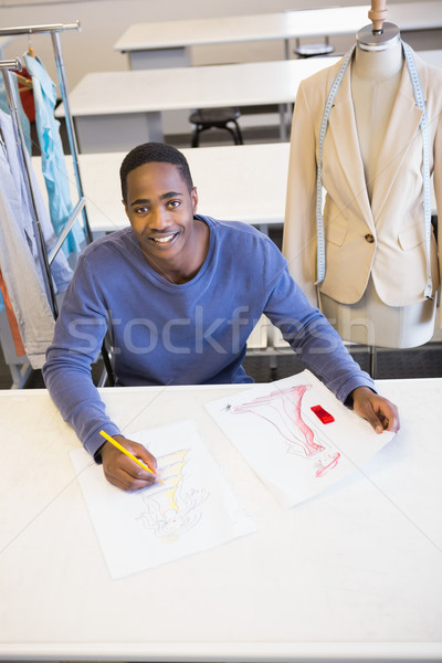 Smiling university student drawing picture Stock photo © wavebreak_media