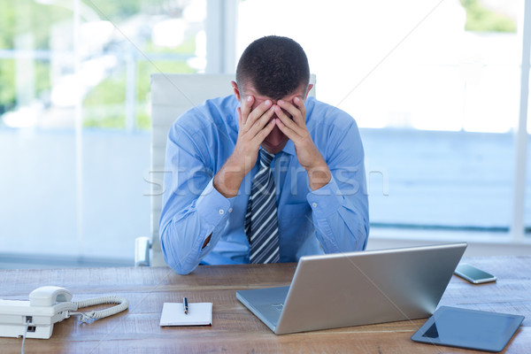 Worried businessman with head in hands  Stock photo © wavebreak_media