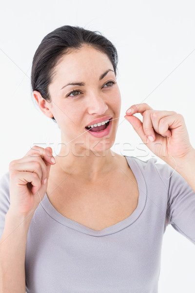 Woman using dental floss Stock photo © wavebreak_media