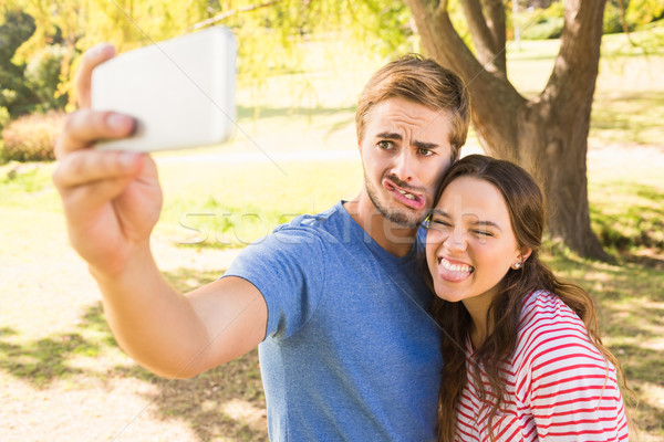 Cute couple doing selfie in the park Stock photo © wavebreak_media