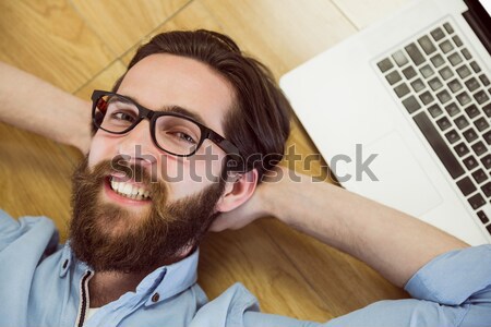 Gut aussehend Hipster mit Laptop Holzboden Computer glücklich Stock foto © wavebreak_media