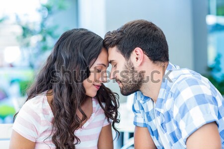 Couple kissing while holding cupcakes Stock photo © wavebreak_media