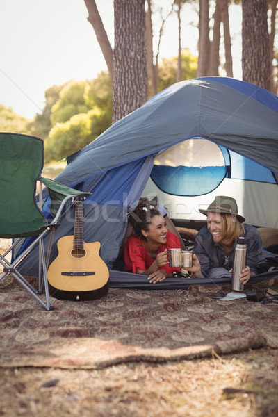 Couple détente tente heureux parler forêt [[stock_photo]] © wavebreak_media