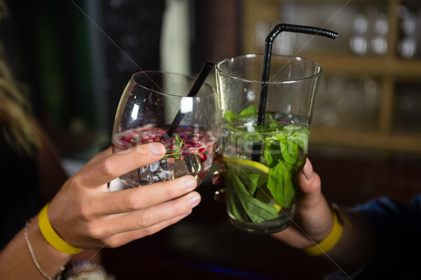 Close-up of friends toasting glasses of cocktail Stock photo © wavebreak_media