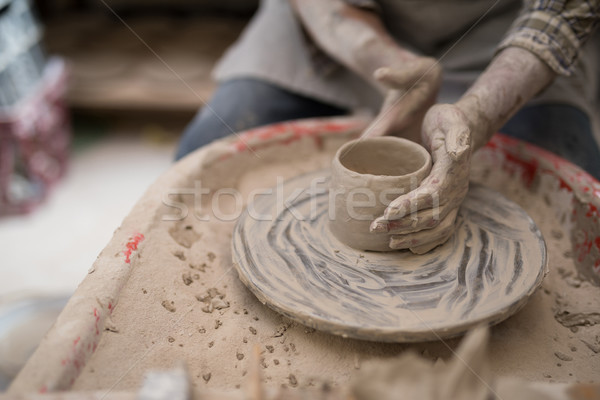 Mid section of male potter molding clay Stock photo © wavebreak_media